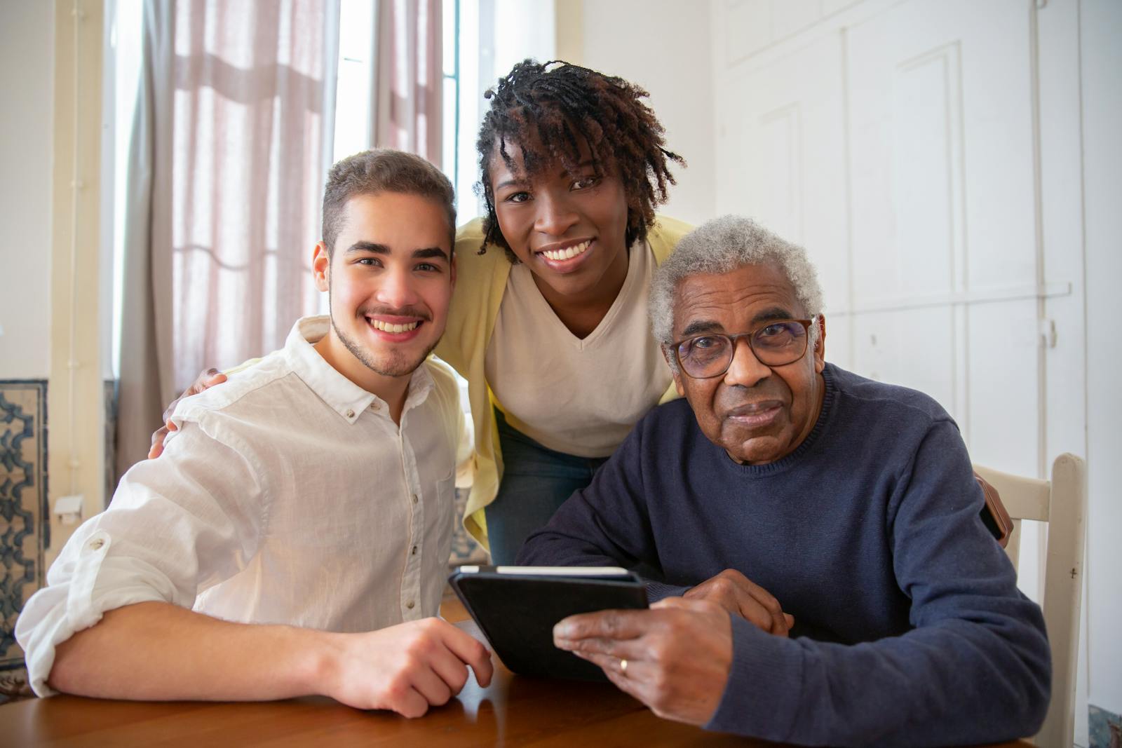 Ezra Care caregiver assisting an elderly client at home